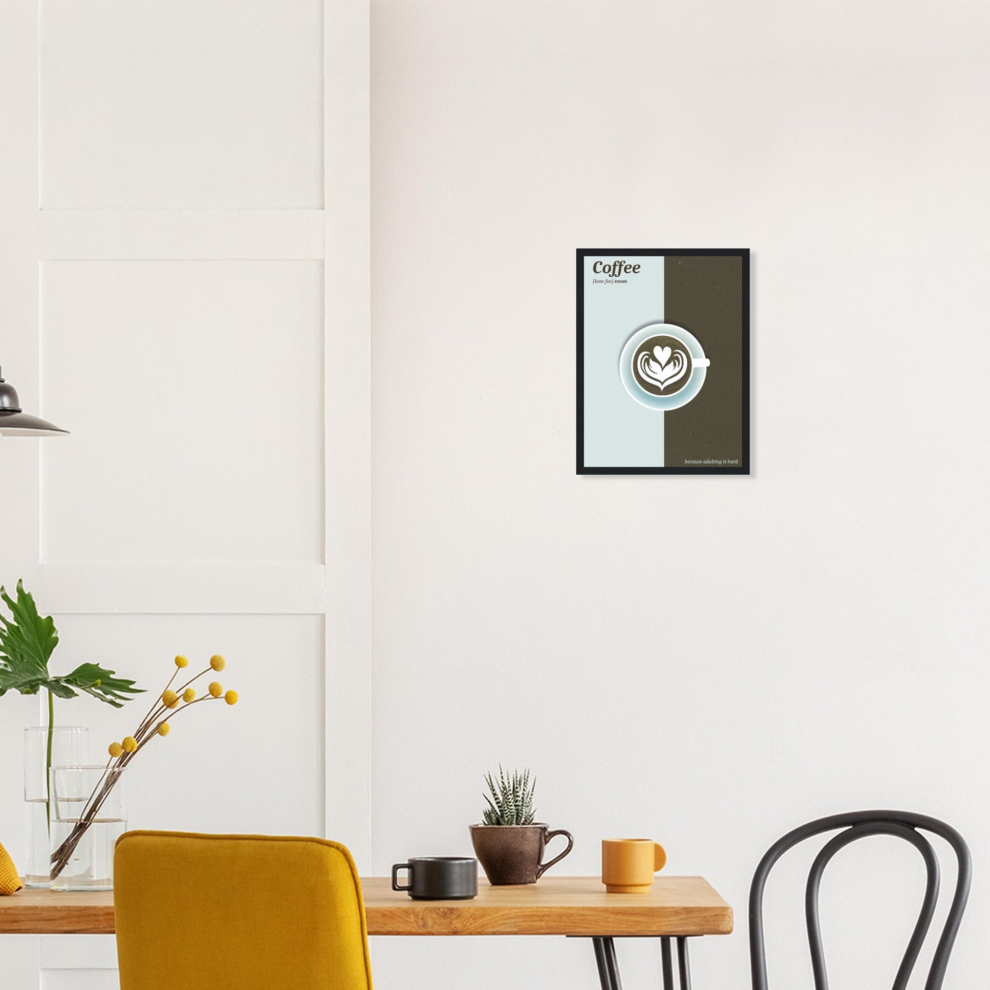 Ein Olive-hellblaues Bild dass in der Mitte farblich unterteilt ist. In der Mitte des Bildes befindet sich eine Hellblau-Olive grüne Tasse Kaffee. Oben Links Steht mit Olive-Grüner Schrift auf Hellblauem: "Coffee [kaw-fee] noun. Unten Rechts gegenteilig: "because adulting is hard" über einem Esstisch an der Wand.