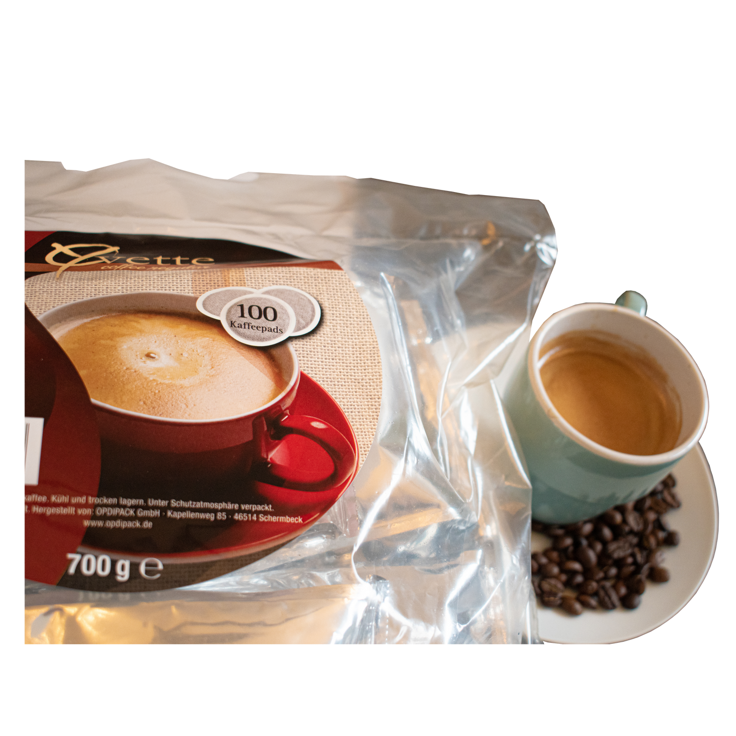 Serviervorschlag Kaffeepads Regular Crema mit Tasse Kaffee und Bohnen